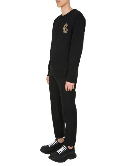 Shop Alexander Mcqueen Embellished Monogram Logo Sweatshirt In Black