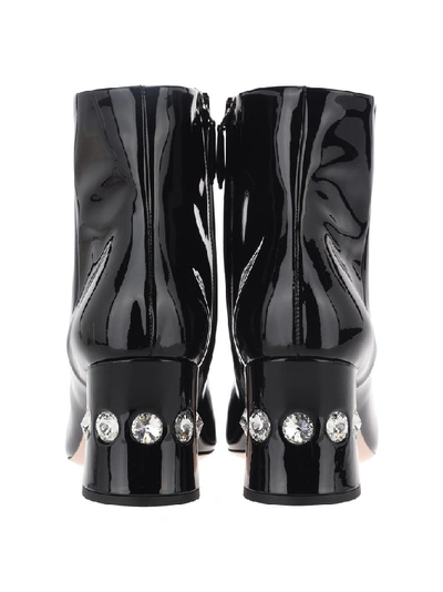 Shop Miu Miu Embellished Boots In Black