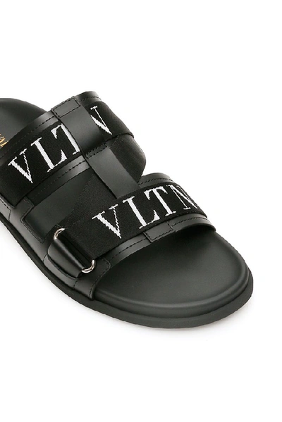 Shop Valentino Vltn Slides In Black