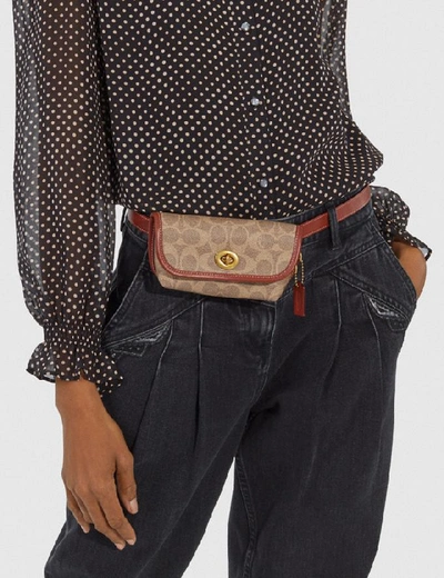 Shop Coach Turnlock Flare Belt Bag In Signature Canvas - Women's In B4/tan Rust
