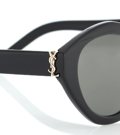 Shop Saint Laurent M60 Oval Sunglasses In Black