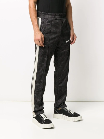 Shop Palm Angels Crocodile-printed Track Pants In Black