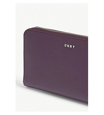 Shop Dkny Bryant Textured Leather Zip-around Wallet In Black/gold