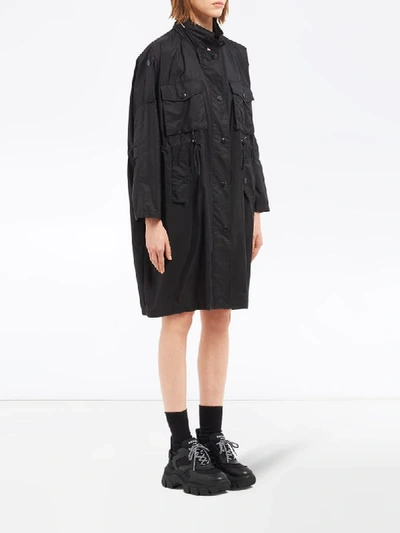 Shop Prada Drawstring Oversized Raincoat In Black