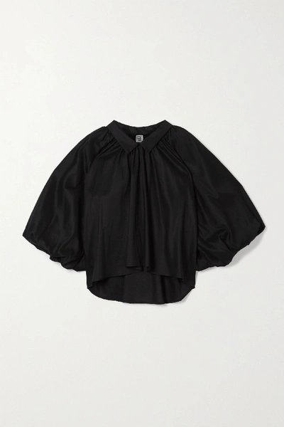 Shop Totême Kerala Oversized Gathered Lyocell And Cotton-blend Blouse In Black