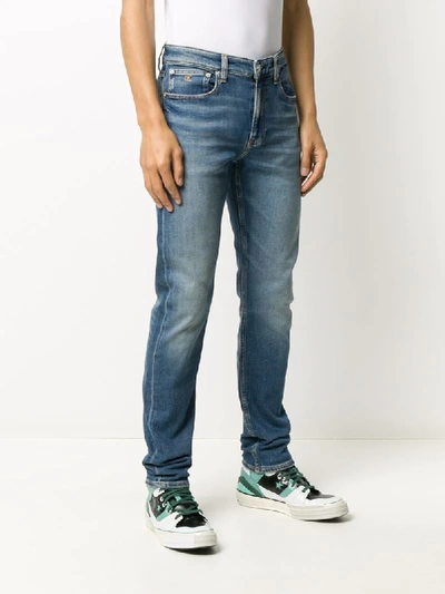 Shop Ck Calvin Klein Stonewashed-effect Slim-fit Jeans In Blue