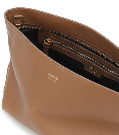 Shop Khaite Adeline Leather Crossbody Bag In Brown