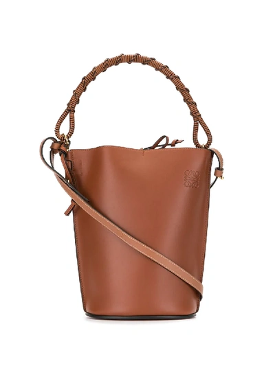 Shop Loewe Debossed Logo Bucket Bag In Brown