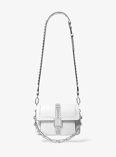 Shop Michael Kors Crawford Studded Leather Crossbody Bag In White