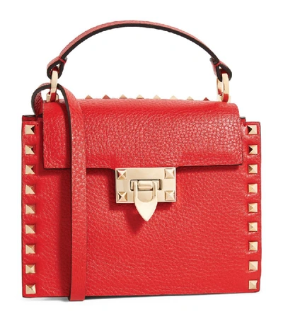 Shop Valentino Garavani Small Rockstud Top-handle Bag