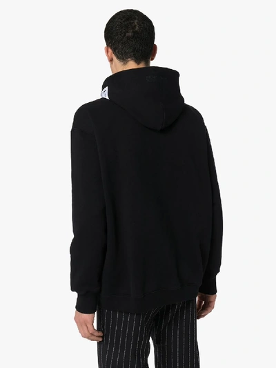 Shop Vetements Logo Print Hoodie In Black