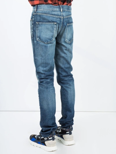 Shop Saint Laurent Midblue Skinny Distressed Jeans