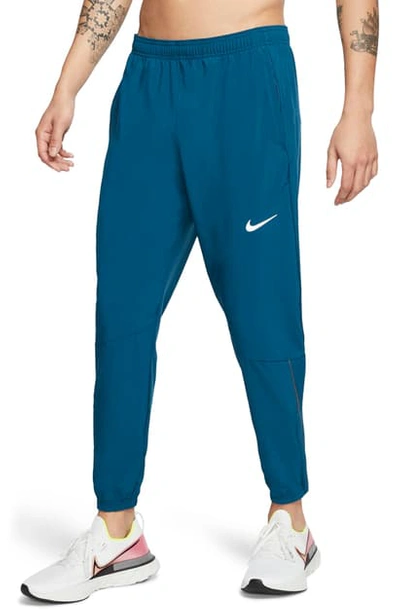 Shop Nike Phantom Essence Athletic Pants In Valerian Blue/ Silver
