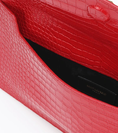 Shop Saint Laurent Uptown Croc-effect Leather Clutch In Red