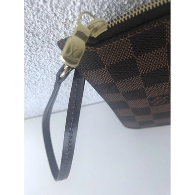 Pre-owned Louis Vuitton Neverfull Cloth Clutch Bag In Brown