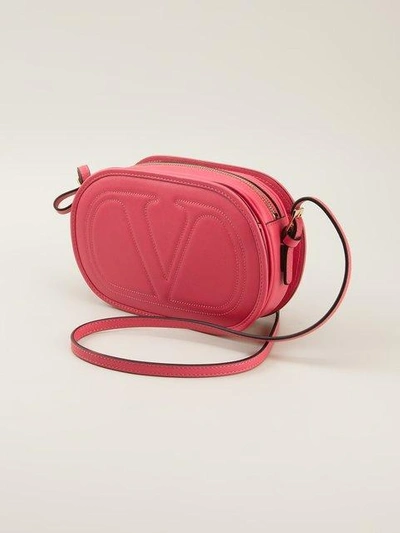 Shop Valentino Embossed Logo Cross Body Bag