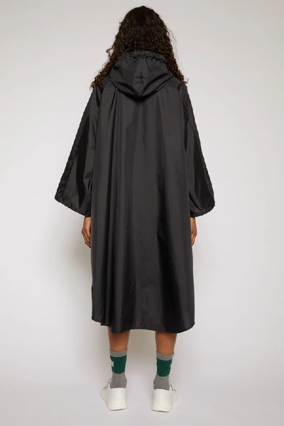 Shop Acne Studios Reflective Face Motif Poncho Black