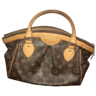 Pre-owned Louis Vuitton Tivoli Cloth Handbag In Brown