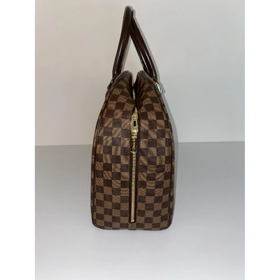 Pre-owned Louis Vuitton Nolita Cloth Handbag In Brown