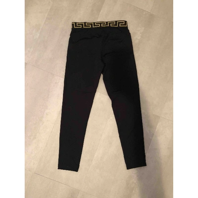 Pre-owned Versace Black Spandex Trousers