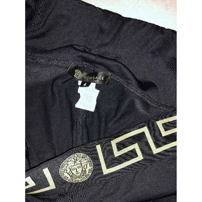 Pre-owned Versace Black Spandex Trousers