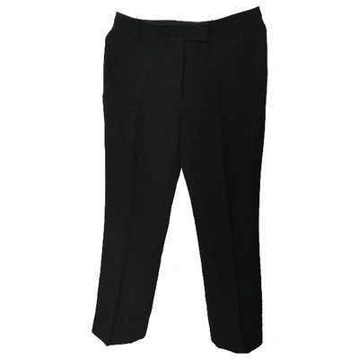 Pre-owned Givenchy Wool Trousers In Black