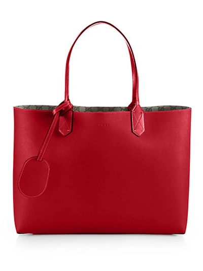 Shop Gucci Reversible Gg Leather Tote In Tabasco