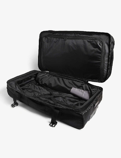 Shop Eastpak Tranverz Cnnct Cabin Suitcase 79cm In Cnnct Coat