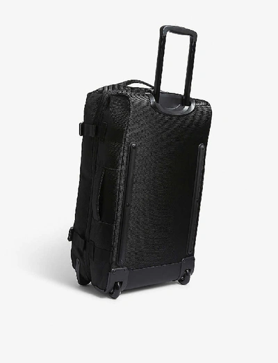 Shop Eastpak Tranverz Cnnct Cabin Suitcase 67cm In Cnnct Coat