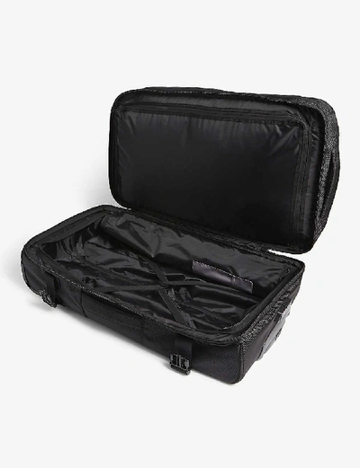 Shop Eastpak Tranverz Cnnct Cabin Suitcase 67cm In Cnnct Coat