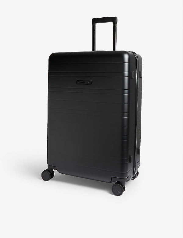 black four wheel suitcase