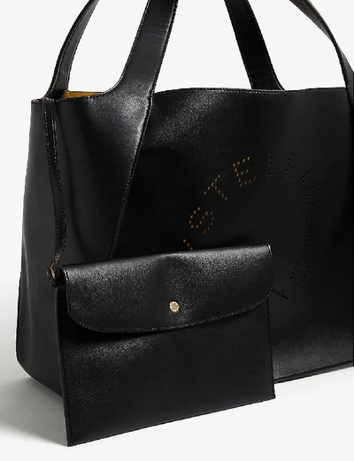 Shop Stella Mccartney Womens Black Circle Perforated-logo Small Faux-leather Tote Bag