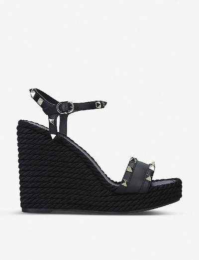 Shop Valentino Rockstud Leather Wedge Sandals In Black