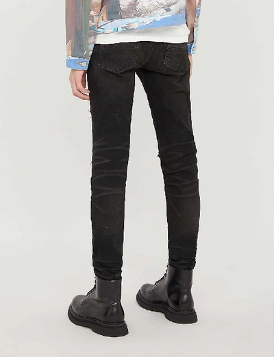 Shop Amiri Thrasher Skinny Jeans In Rough