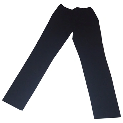 Pre-owned Moschino Wool Straight Trousers In Black