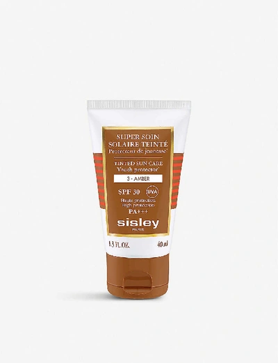 Shop Sisley Paris Tinted Spf30 Sun Care Cream 40ml In Amber