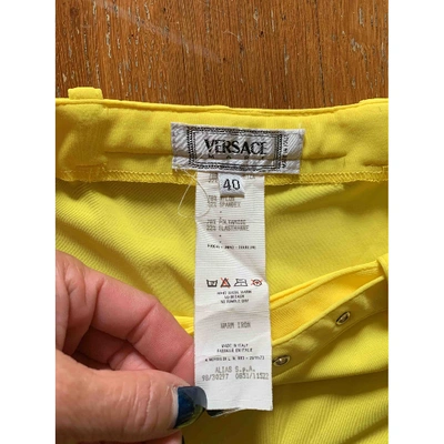 Pre-owned Versace Yellow Trousers