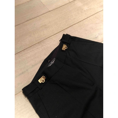 Pre-owned Ferragamo Wool Trousers In Black