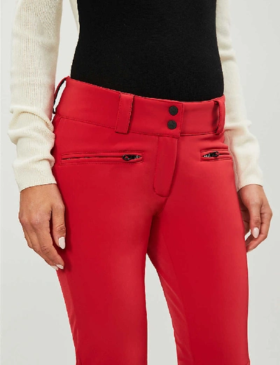 Shop Perfect Moment Chevron Flared Shell Trousers In Red