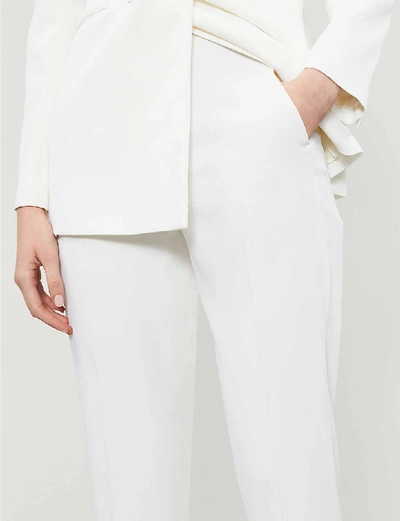 Shop Sandro Jens Stretch-crepe Trousers In Ivory