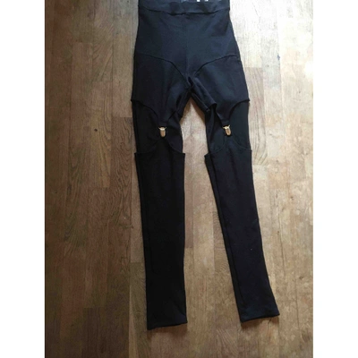 Pre-owned Murmur Trousers In Black