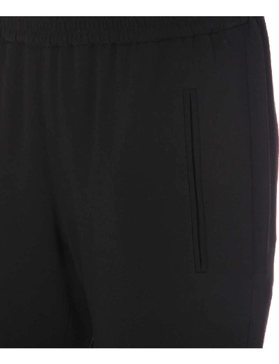 Shop Stella Mccartney Tamara Low-rise Stretch-crepe Tapered Trousers In Blk