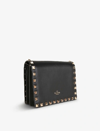 Shop Valentino Rockstud Leather Cross-body Bag In Black