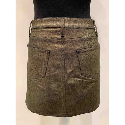 Pre-owned Saint Laurent Gold Cotton - Elasthane Skirt