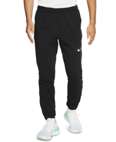 Shop Nike Men's Therma Essential Running Pants In Black