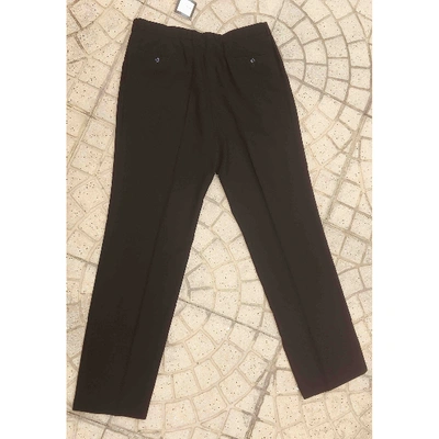 Pre-owned Dior Wool Trousers In Black