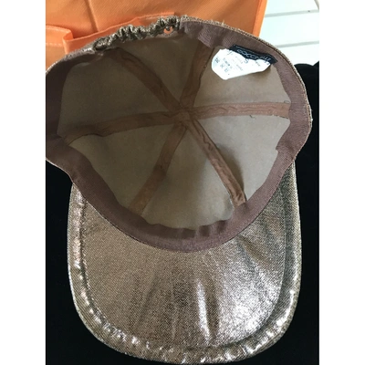Pre-owned Coccinelle Cap In Gold