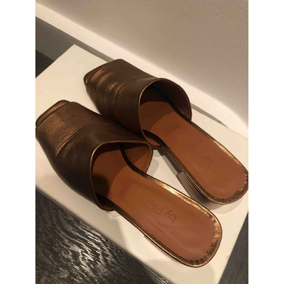 Pre-owned By Far Leather Mules & Clogs In Gold