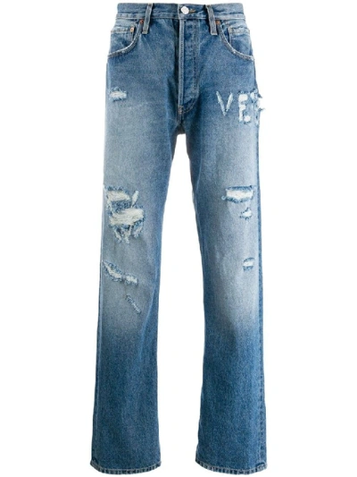 Shop Vetements Distressed Logo Jeans In Blue