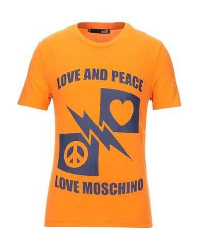 Shop Love Moschino T-shirts In Orange